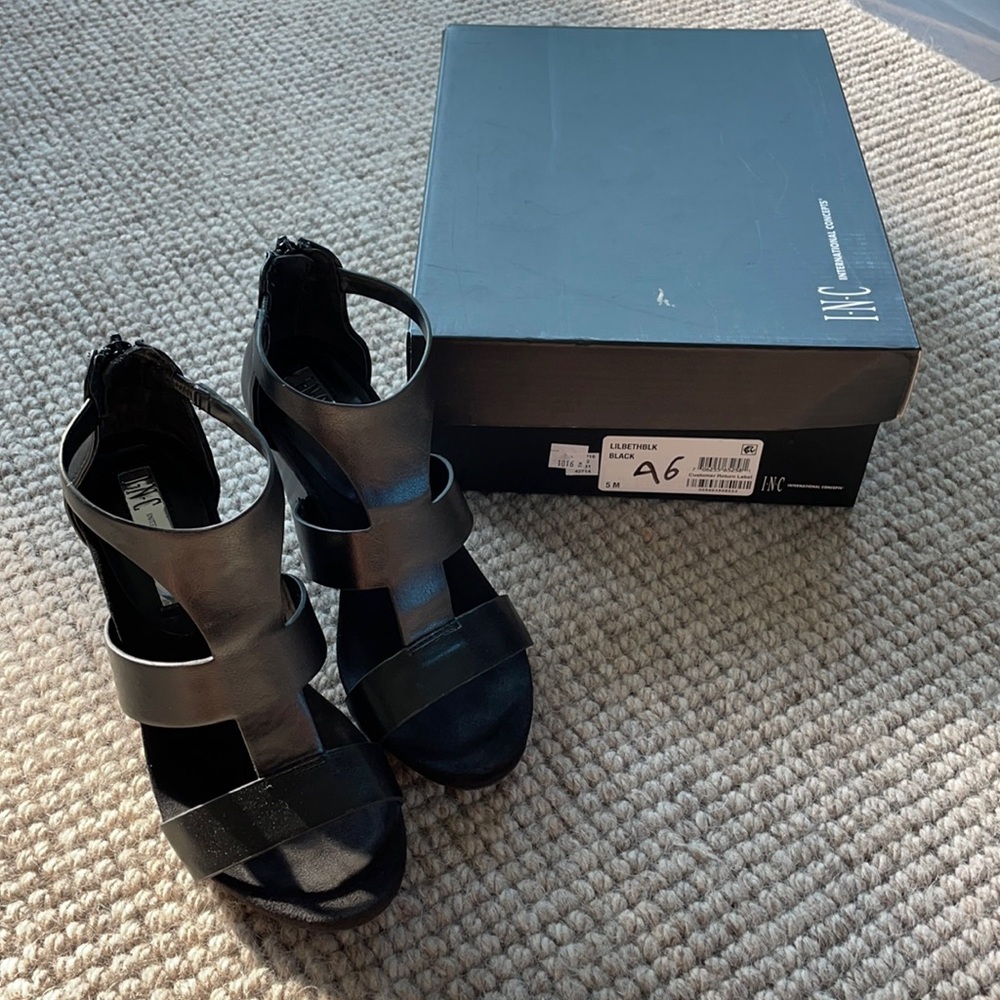 Wedge sandal.  3 1/4”. Black Size 5. Gently worn.